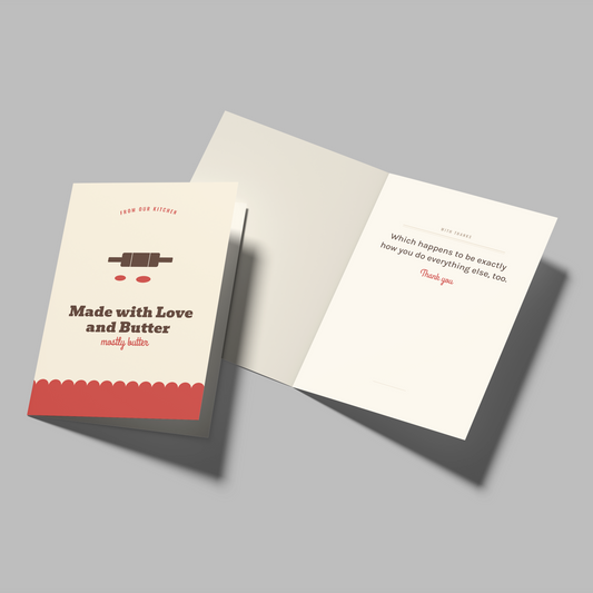A folded greeting card set shown on a light gray background, with one card closed displaying the front design and another card open showing the inside message.