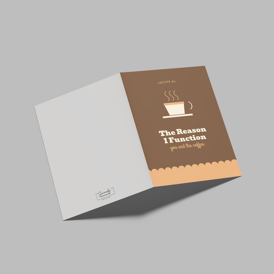 A folded brochure or booklet shown open on a plain gray background. The right panel is brown with a coffee cup illustration and the text 'The Reason I Function' and 'powered by coffee'; the left panel is white.