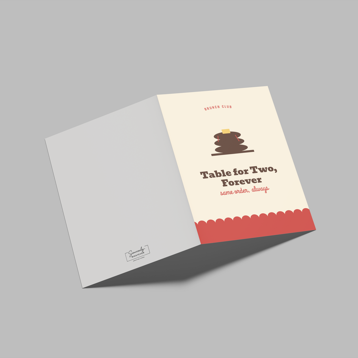 An open greeting card or booklet on a plain gray background. The right panel is cream with a small cake illustration, the text 'Table for Two, Forever' and smaller decorative text, plus a coral scalloped border.