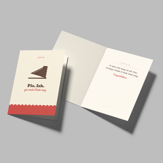 An open greeting card and its matching closed cover shown on a plain gray background. The card has a cream cover with a brown piano illustration and red text, and the inside pages are also cream with red and brown text.