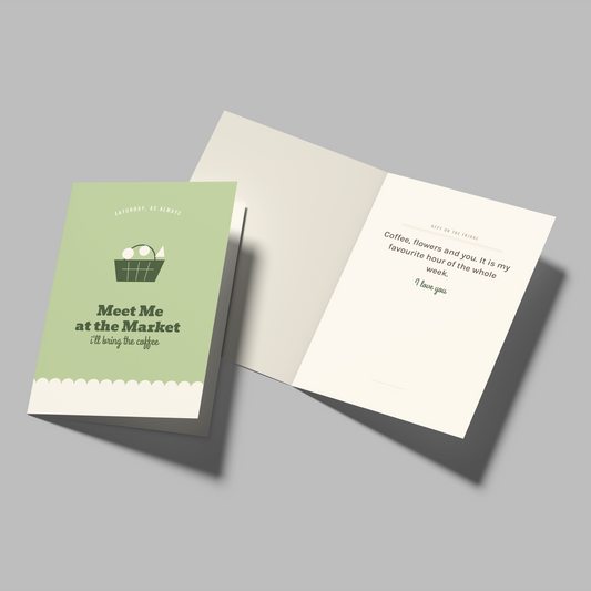 A greeting card set shown on a plain gray background, with one closed card featuring a light green cover and the text 'Meet Me at the Market I'll be at the pigsty' and an illustration of eggs, and one open card showing a white interior with a short poem.