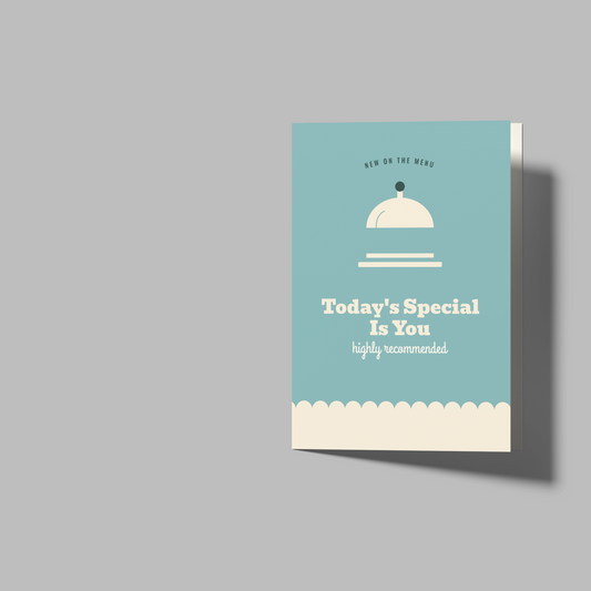 A set of blank greeting cards and envelopes shown on a neutral gray background. On the left is a folded card with a light blue front panel featuring a white cloche illustration and the text 'Today's Special Is You'.