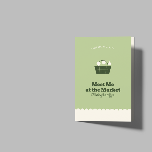 A mockup showing a folded greeting card and two blank folded card templates on a solid gray background. The card on the left features a sage green front cover with a basket of eggs illustration and the text 'Meet Me at the Market (I'm your sign)'.